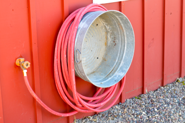 A galvanized tub can be also used to store your garden hose