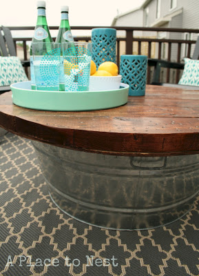 Build your own outdoor coffee table using some lumber and a galvanized tub