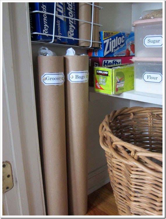 Use mailing tubes to store plastic grocery bags and paper towel tubes