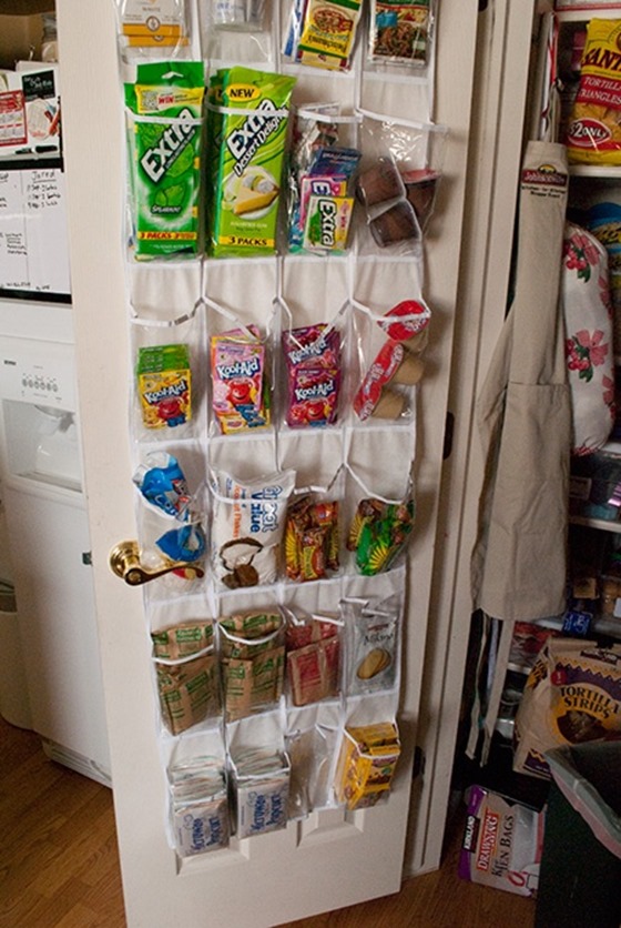 Use over-the-door shoe storage to organize snacks in pantry